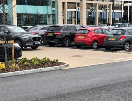 Coloured paving for parking bays